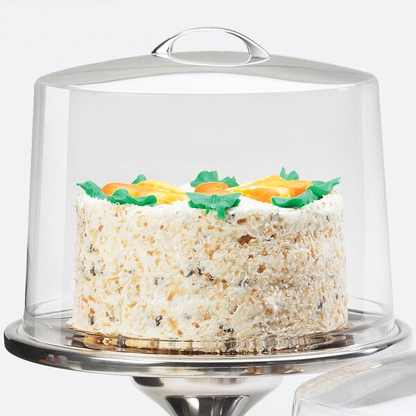 A cake on a Cal-Mil acrylic cake cover.