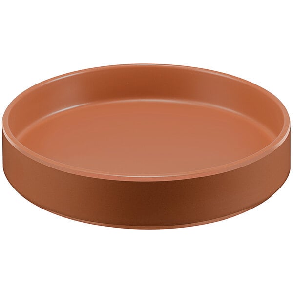 A brown round Cal-Mil melamine plate with a raised rim.