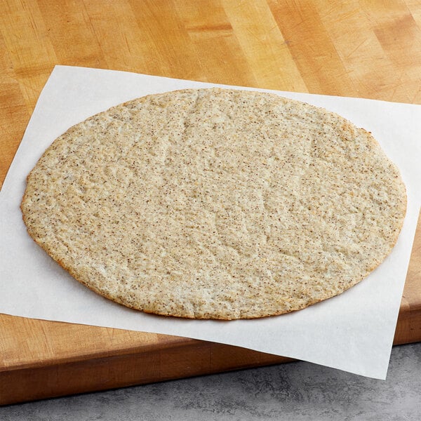 A Rich's vegan cauliflower pizza crust on a cutting board.