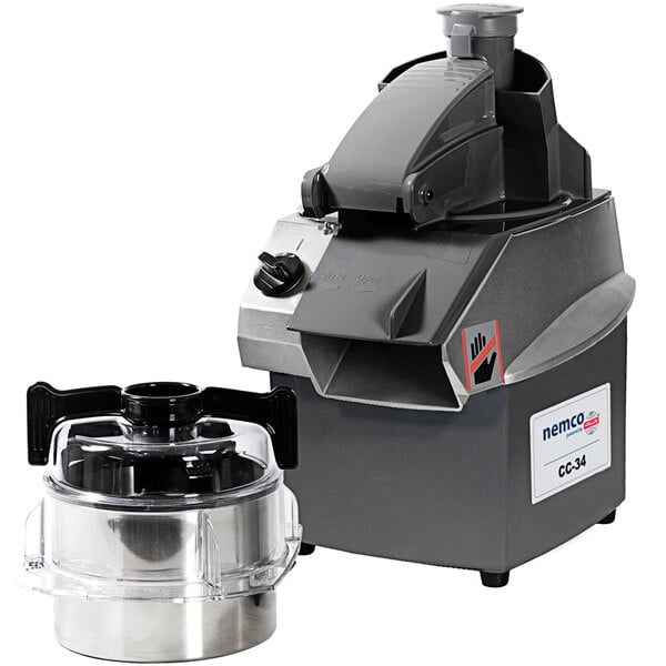 A Nemco commercial food processor with a stainless steel bowl and a lid.