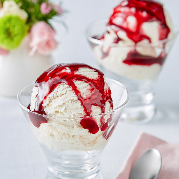 Two glasses of ice cream topped with J. Hungerford Smith Black Raspberry Dessert Topping.