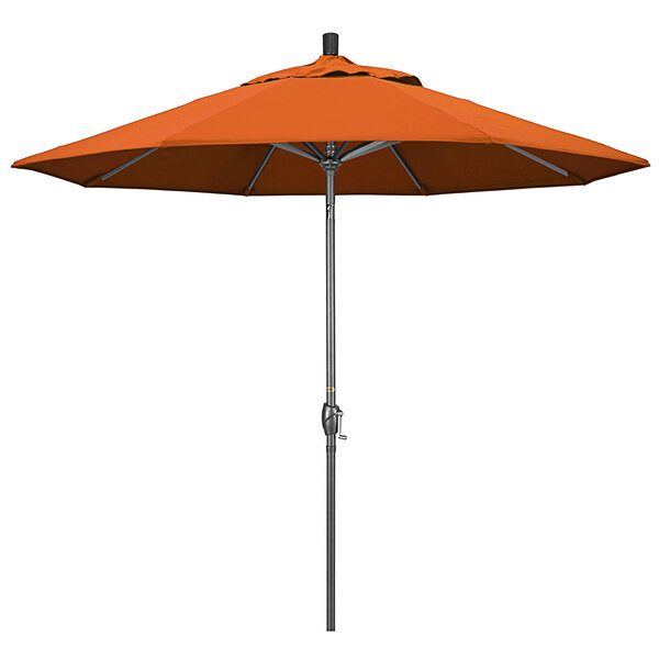 An orange umbrella with a hammertone metal pole.