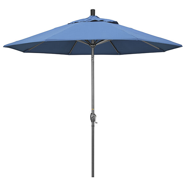 A blue California Umbrella on a metal pole.