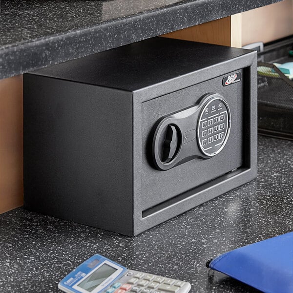 A black 360 Office Furniture steel security safe with an electronic keypad lock.