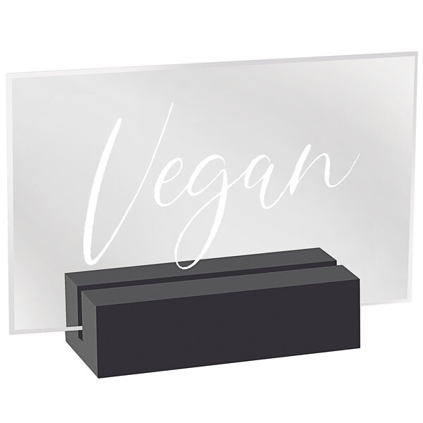 A black wood and clear acrylic rectangular sign that says "Vegan"
