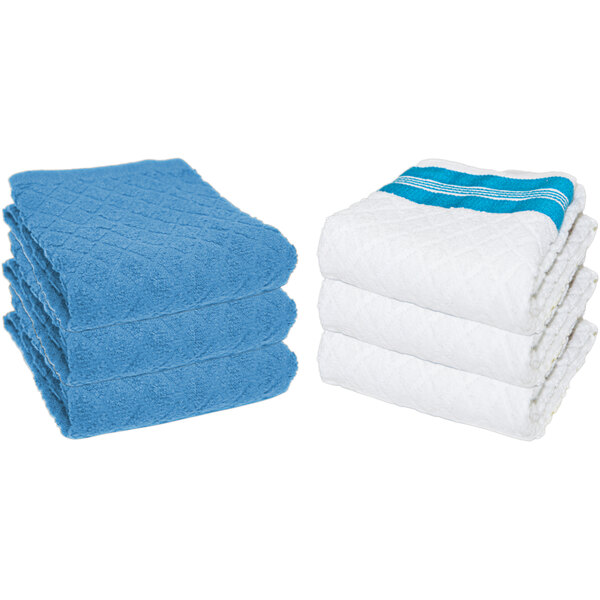 A stack of blue towels with diamond patterns and stripes.
