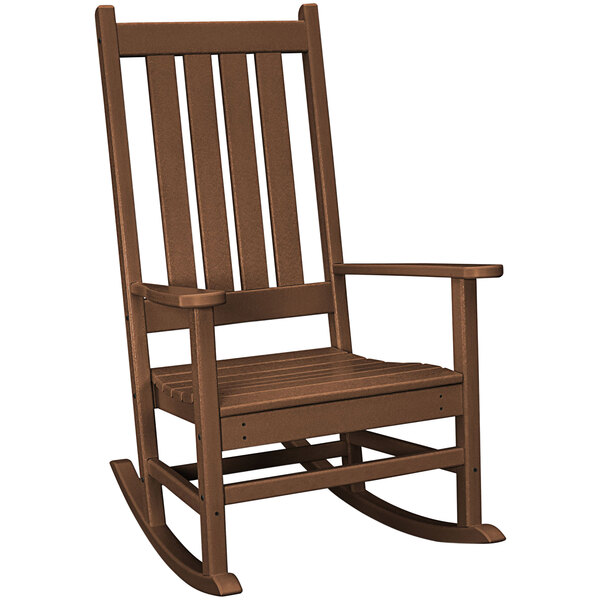 A brown POLYWOOD Vineyard rocking chair with armrests.