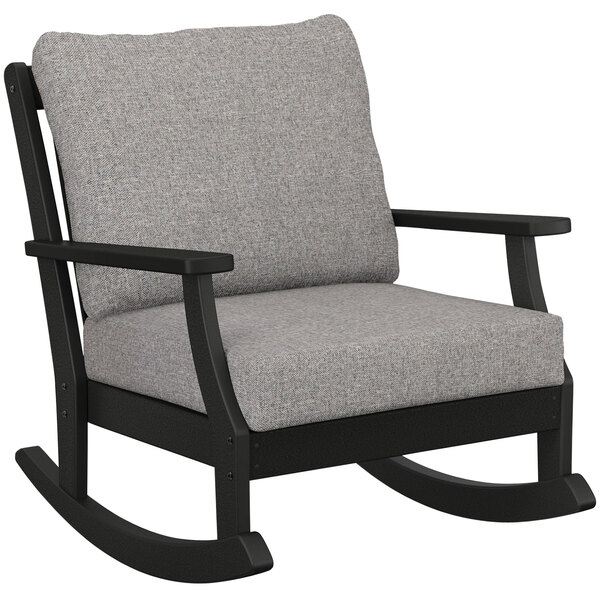 A black POLYWOOD Braxton rocking chair with grey cushions.