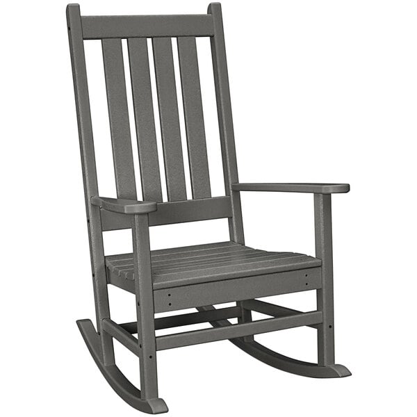 A POLYWOOD grey rocking chair with armrests.