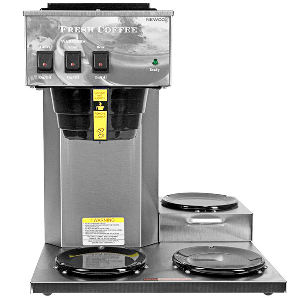 A Newco pourover coffee brewer on a counter with three warmers.