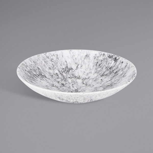 A white bowl with a black and white marble design.