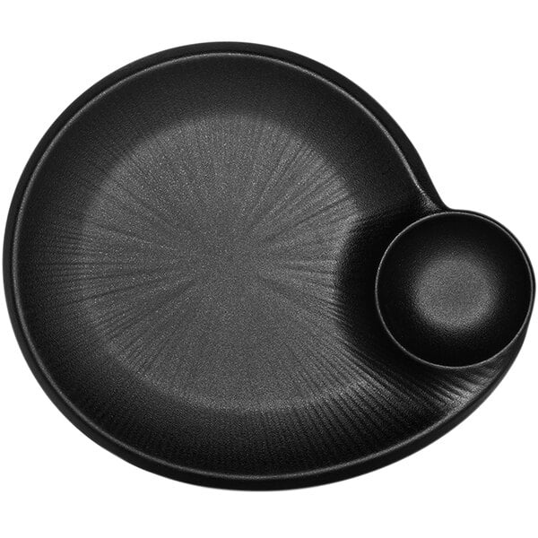A black Elite Global Solutions Hermosa chip and dip plate with a small bowl on top.