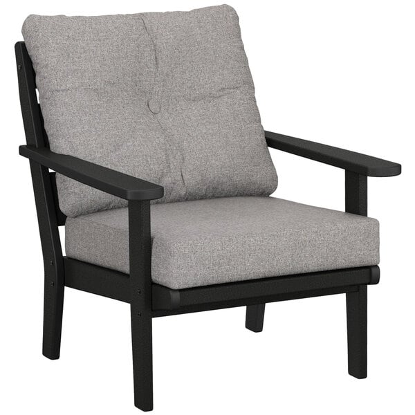 A black and grey POLYWOOD Lakeside deep seating chair with a cushion.