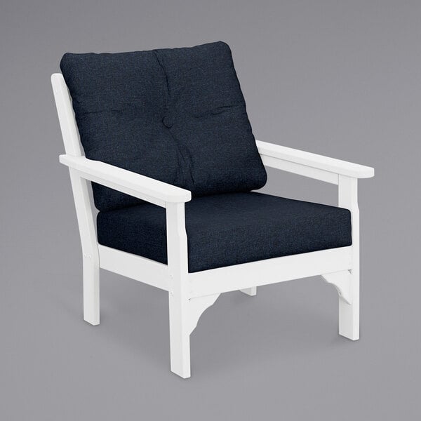 A white POLYWOOD Vineyard deep seating chair with a blue cushion.