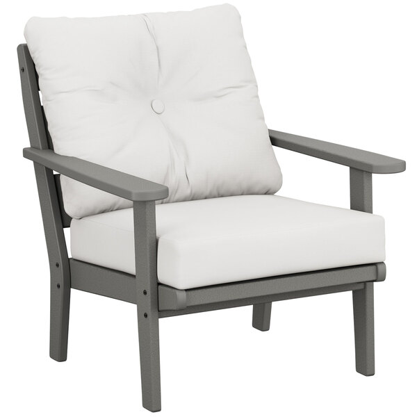 A Lakeside Slate Grey POLYWOOD deep seating chair with a natural linen cushion.