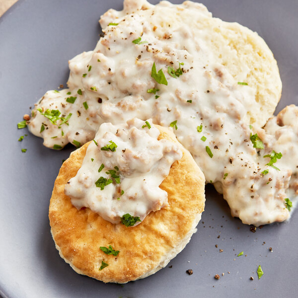 A plate of biscuits and gravy with White Lily Enriched Self-Rising Flour biscuits.