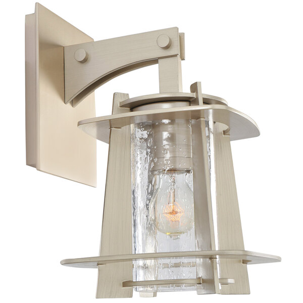 A Kalco Shelby wall sconce with a clear glass shade on a white background.