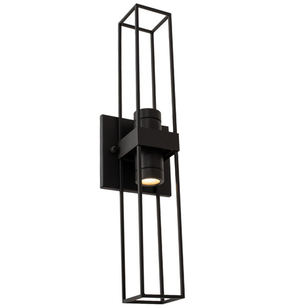 A Kalco Eames matte black wall sconce with a square design and a light on.