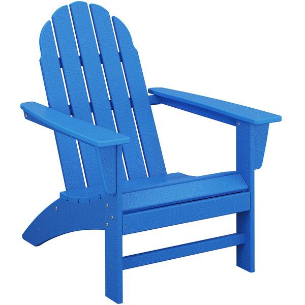A POLYWOOD blue Adirondack chair with armrests.