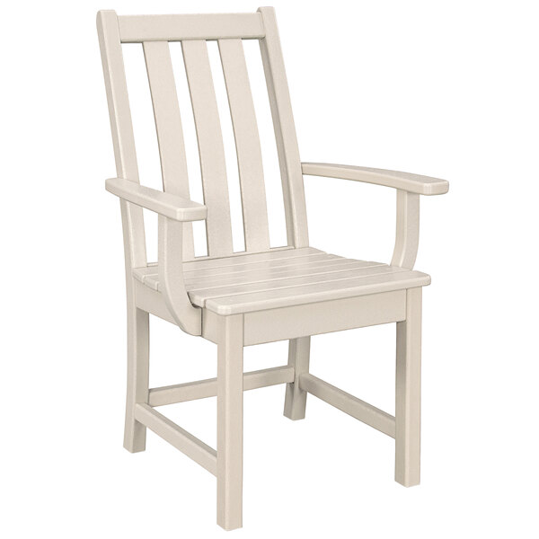 A white POLYWOOD dining arm chair with wooden armrests.