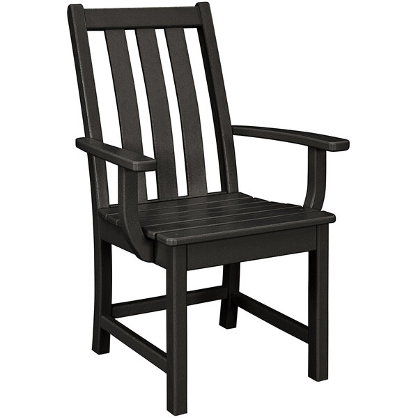 A black POLYWOOD dining arm chair with armrests.