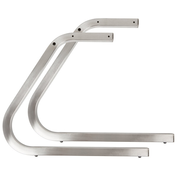 A pair of stainless steel C-legs.