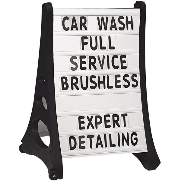 A white Aarco curved letterboard panel with black text that says "Car Wash Full Service Brushless Detailing Expert".