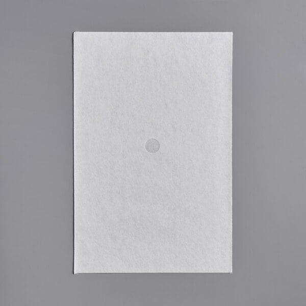 A white rectangular object with a circle on it.