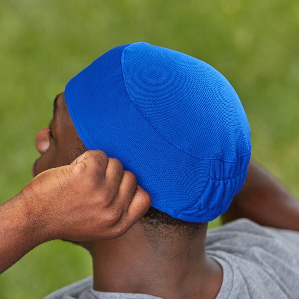 A man wearing a blue Ergodyne Chill-Its skull cap.
