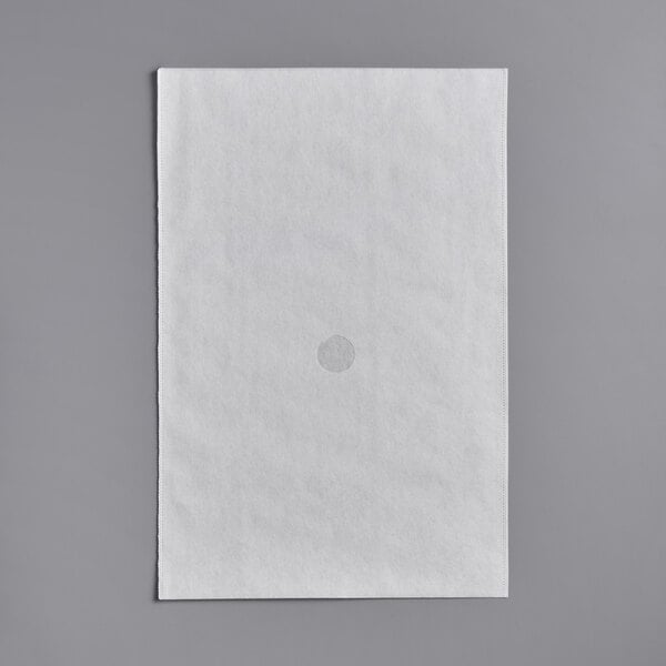 A white paper with a hole in the middle.