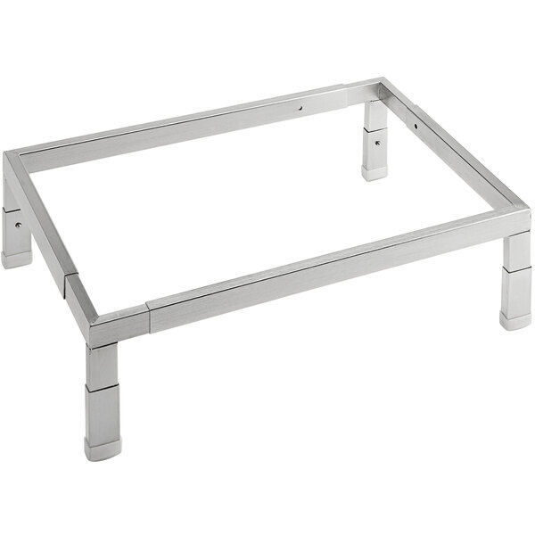 An American Metalcraft silver metal display stand with legs.