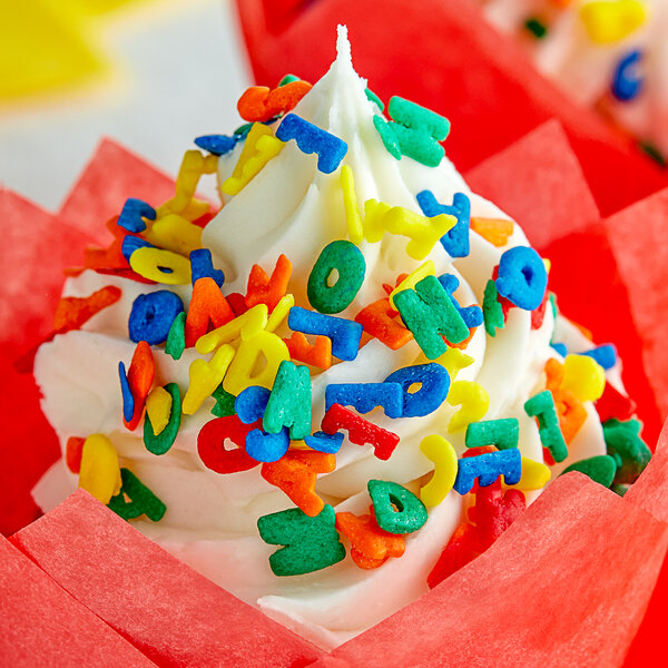 A cupcake with Rainbow Alphabet Sprinkles on top.