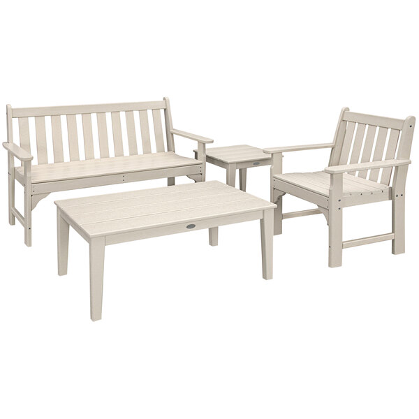 A POLYWOOD white outdoor bench and table set.
