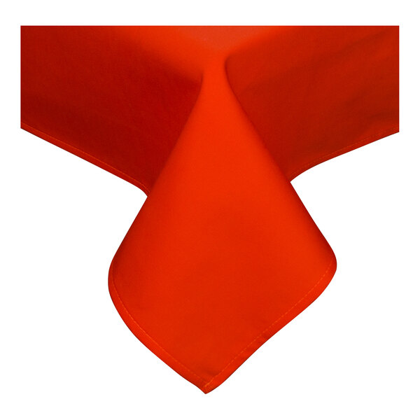 An orange square tablecloth with a folded edge on a white surface.