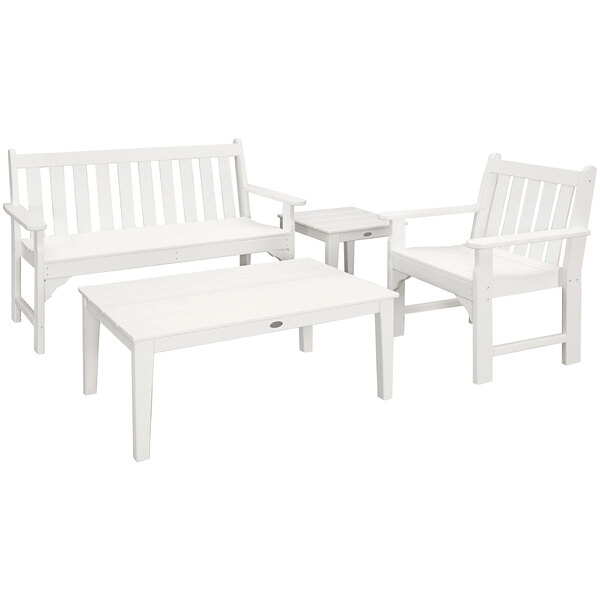 A group of white chairs and a table on a white background.
