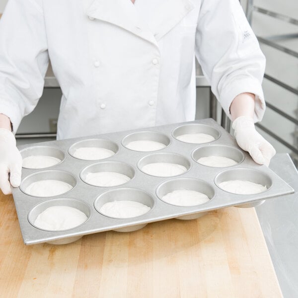 HUBERT® 5 oz Aluminized Steel 24 Cup Large Muffin Pan with Silicone Glaze -  17 7/8L x 25 7/8W x 1 1/4D