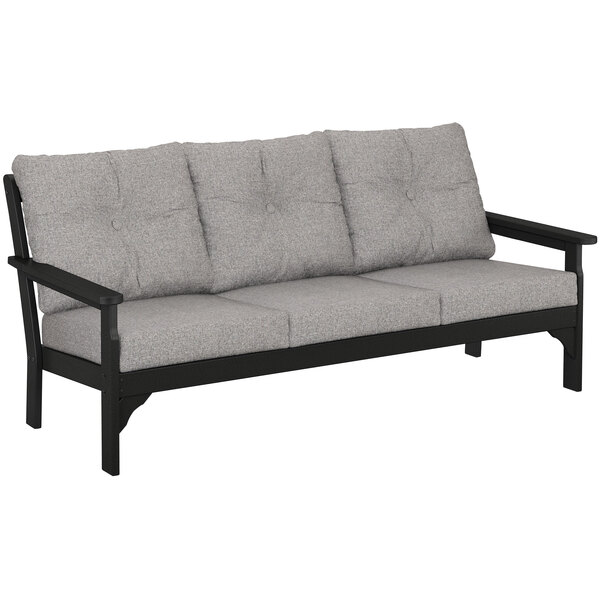 A black and grey POLYWOOD Vineyard deep seating sofa with cushions.