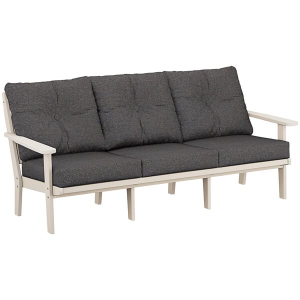 A POLYWOOD outdoor sofa with a white frame and grey cushions.