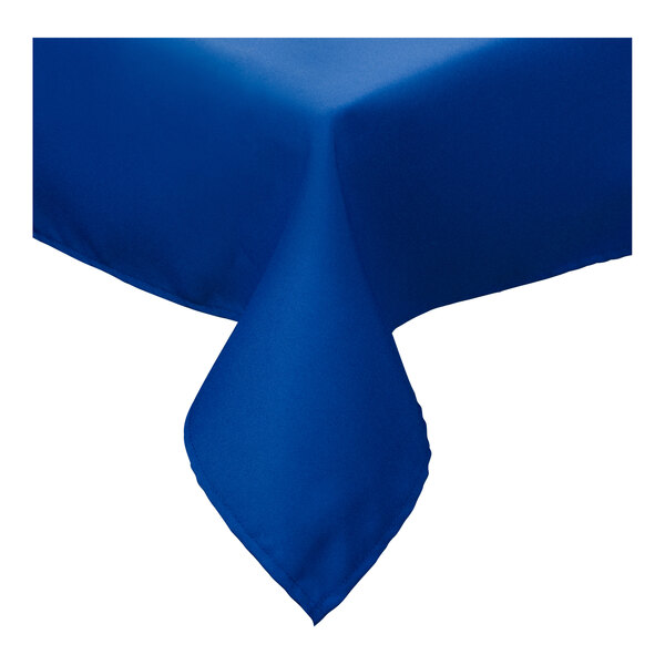 A royal blue Intedge poly/cotton blend tablecloth folded on a table.