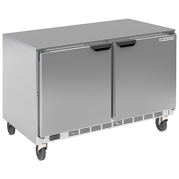 A silver Beverage-Air undercounter refrigerator with two doors on wheels.