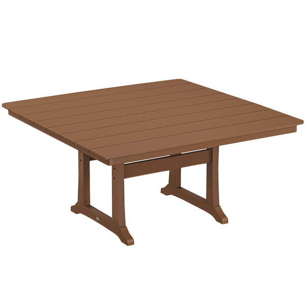 A brown POLYWOOD dining table with trestle legs on an outdoor patio.