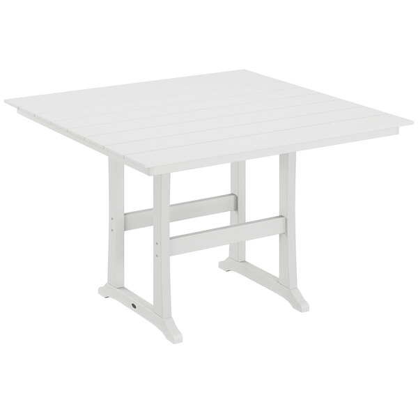 A white POLYWOOD bar height table with trestle legs.