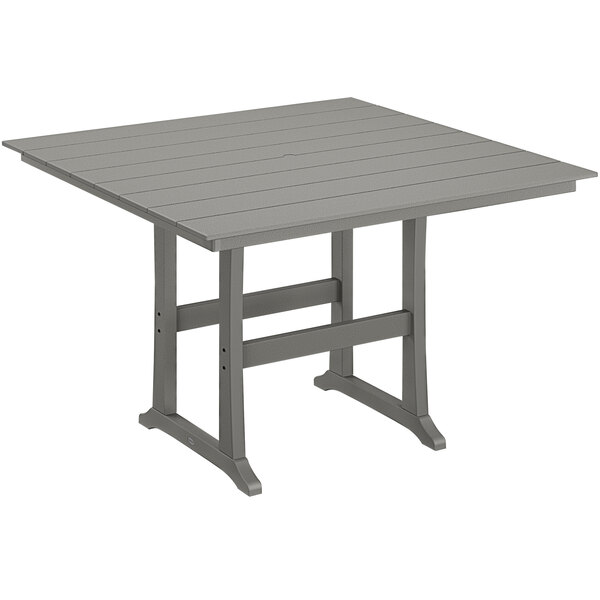 A grey POLYWOOD bar height table with legs.