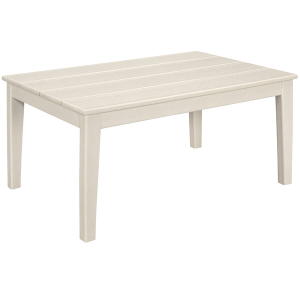 A white POLYWOOD coffee table with wooden slats on the top and white legs.