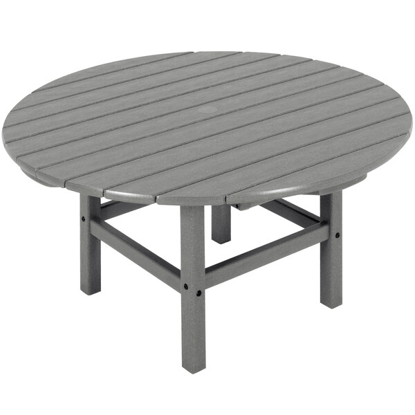 A POLYWOOD round slate grey outdoor table with legs.
