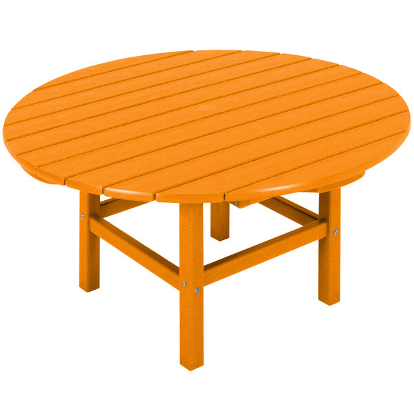 A POLYWOOD round wooden table with legs in tangerine.