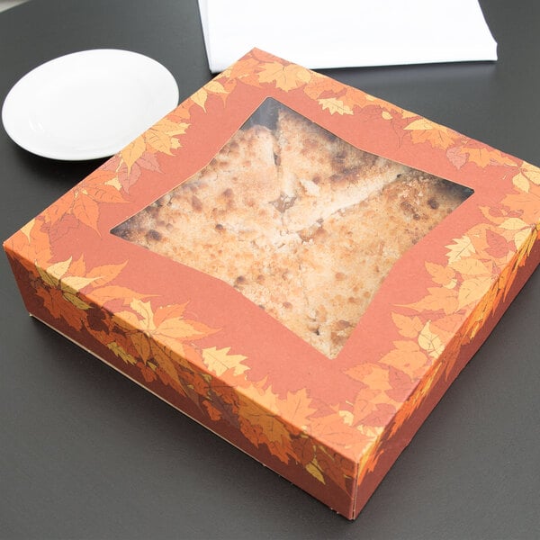A Rustic Orange window pie box with an autumn leaf design.