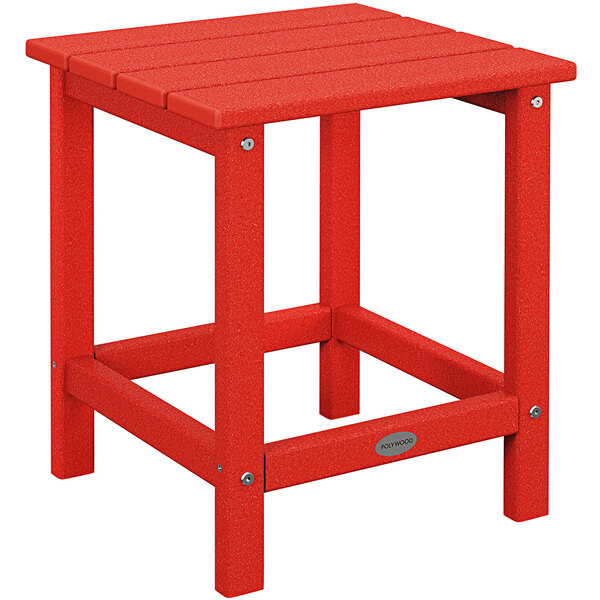 A POLYWOOD sunset red side table on a metal base.
