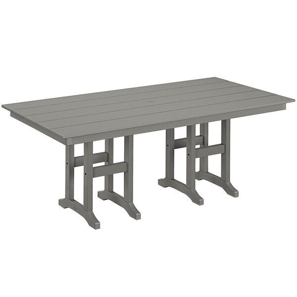 A POLYWOOD slate grey dining table with legs.