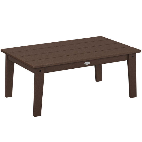 A brown POLYWOOD rectangular coffee table with legs on an outdoor patio.